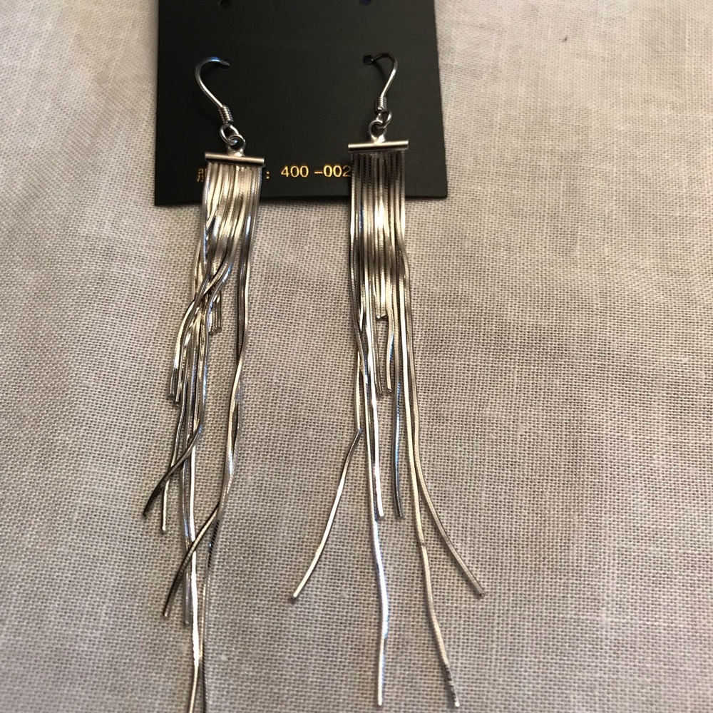 Silver earrings with tag